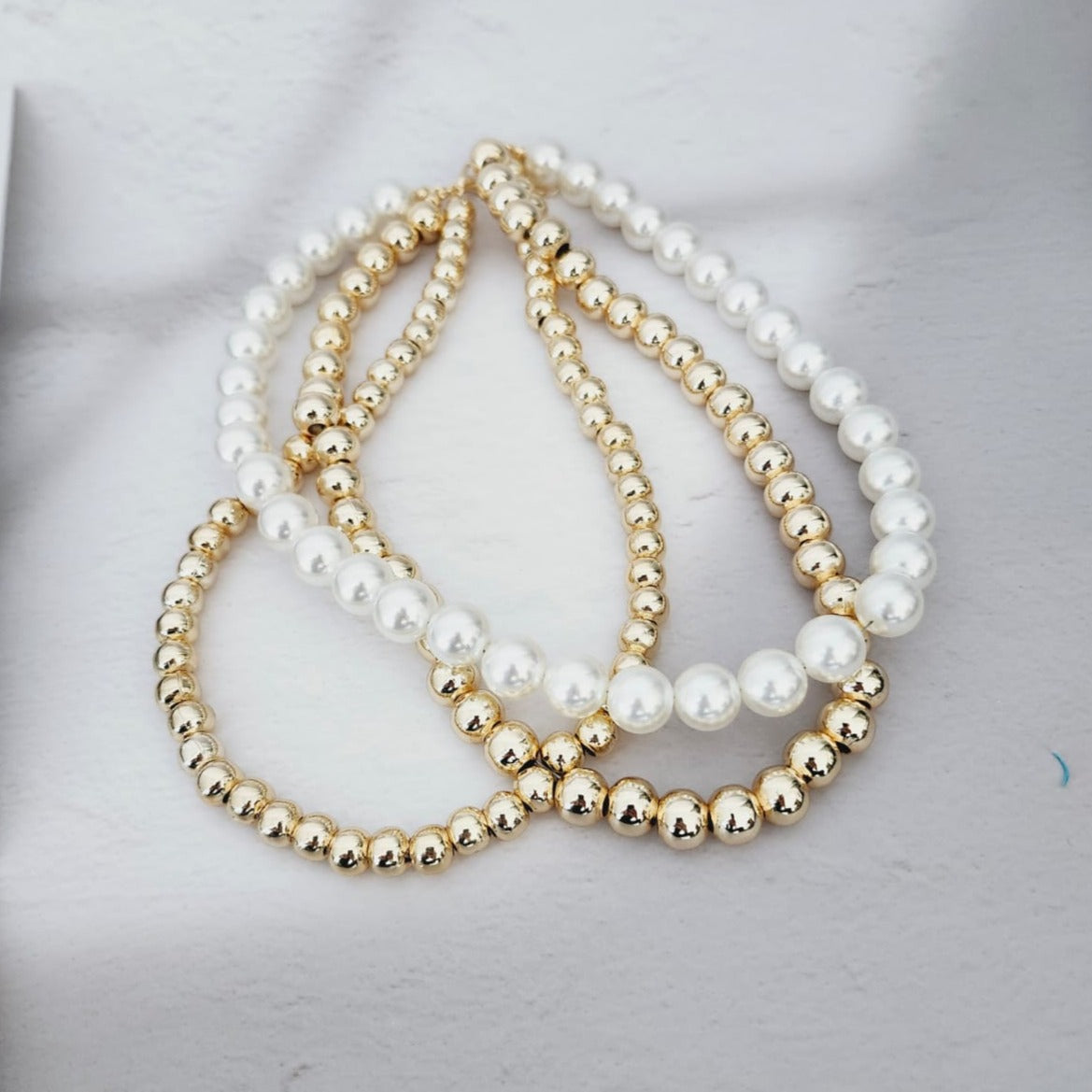 Dazzling 14K Steel Necklace The Finesse of Elegance with Triple Pearls and Gold Bead Details