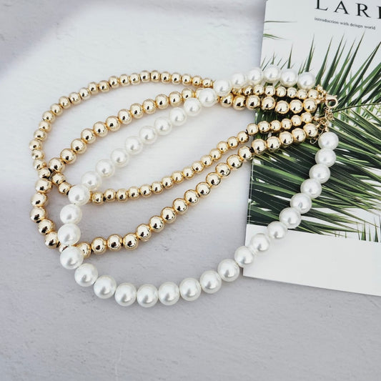 Dazzling 14K Steel Necklace The Finesse of Elegance with Triple Pearls and Gold Bead Details