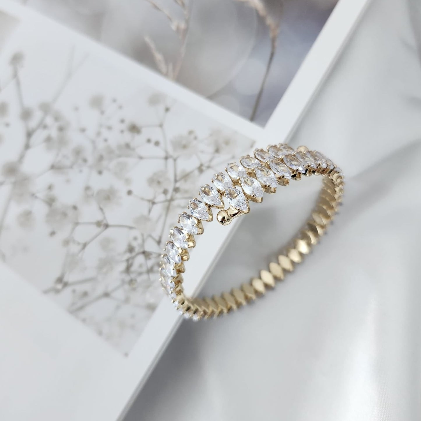 Illuminate with Elegance Stand Out with the Crystal-Studded Gold Bracelet