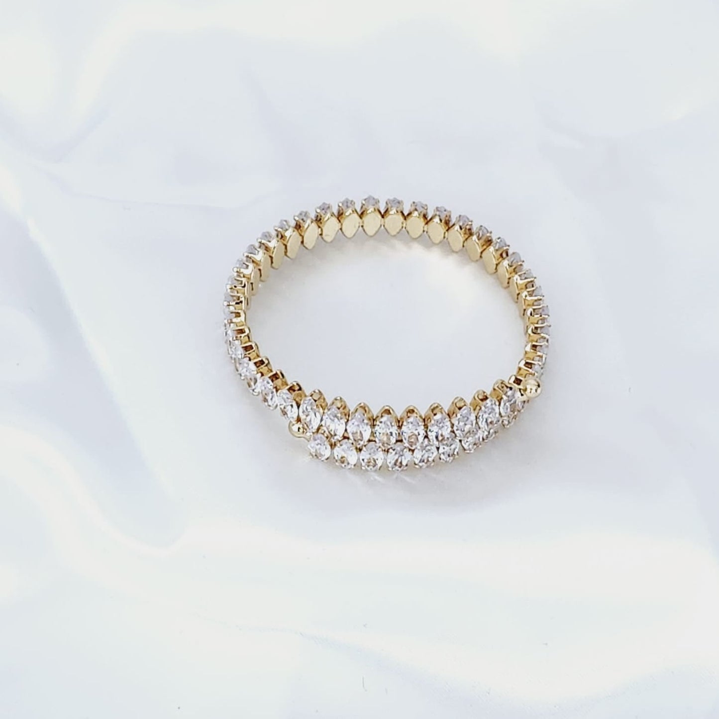 Illuminate with Elegance Stand Out with the Crystal-Studded Gold Bracelet