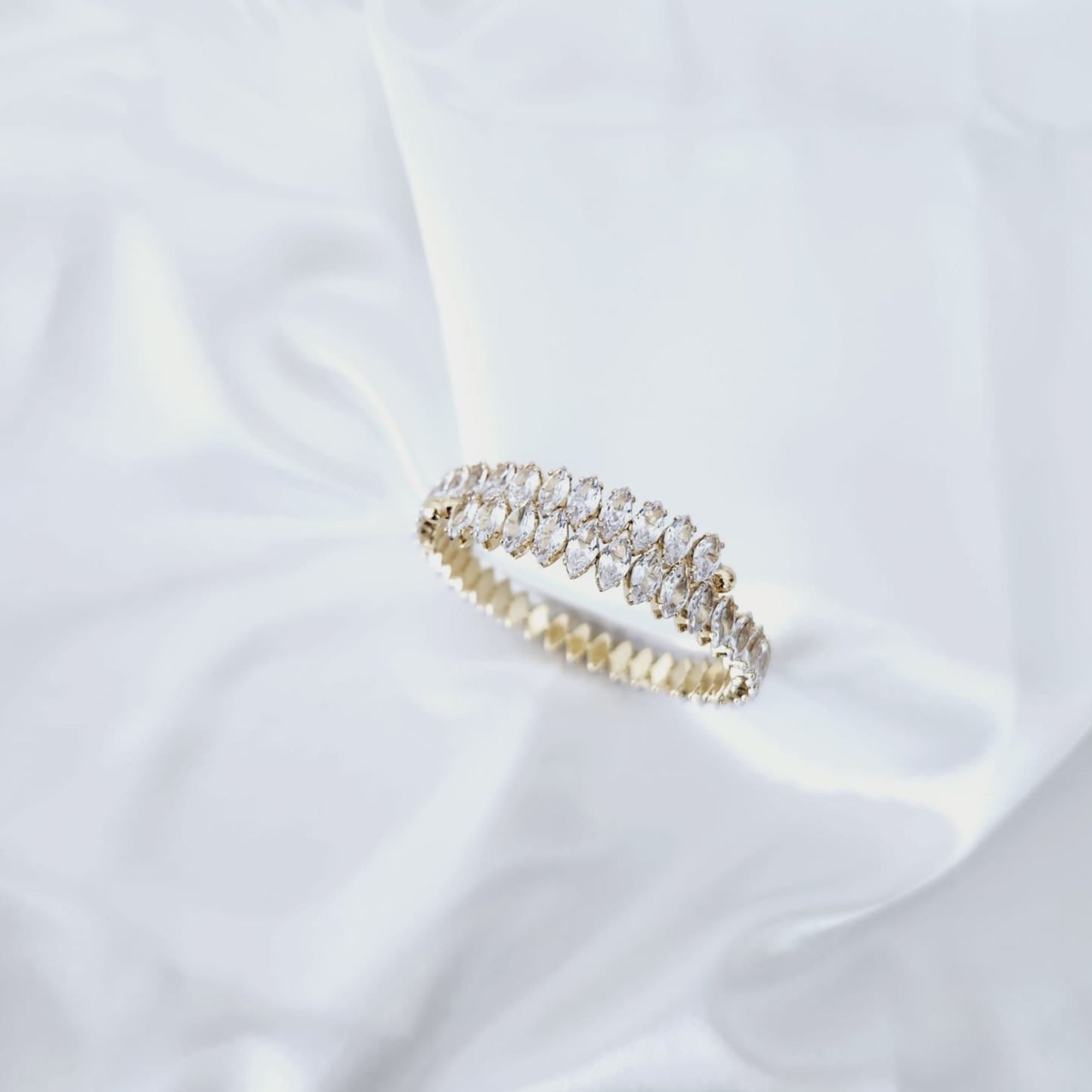 Illuminate with Elegance Stand Out with the Crystal-Studded Gold Bracelet