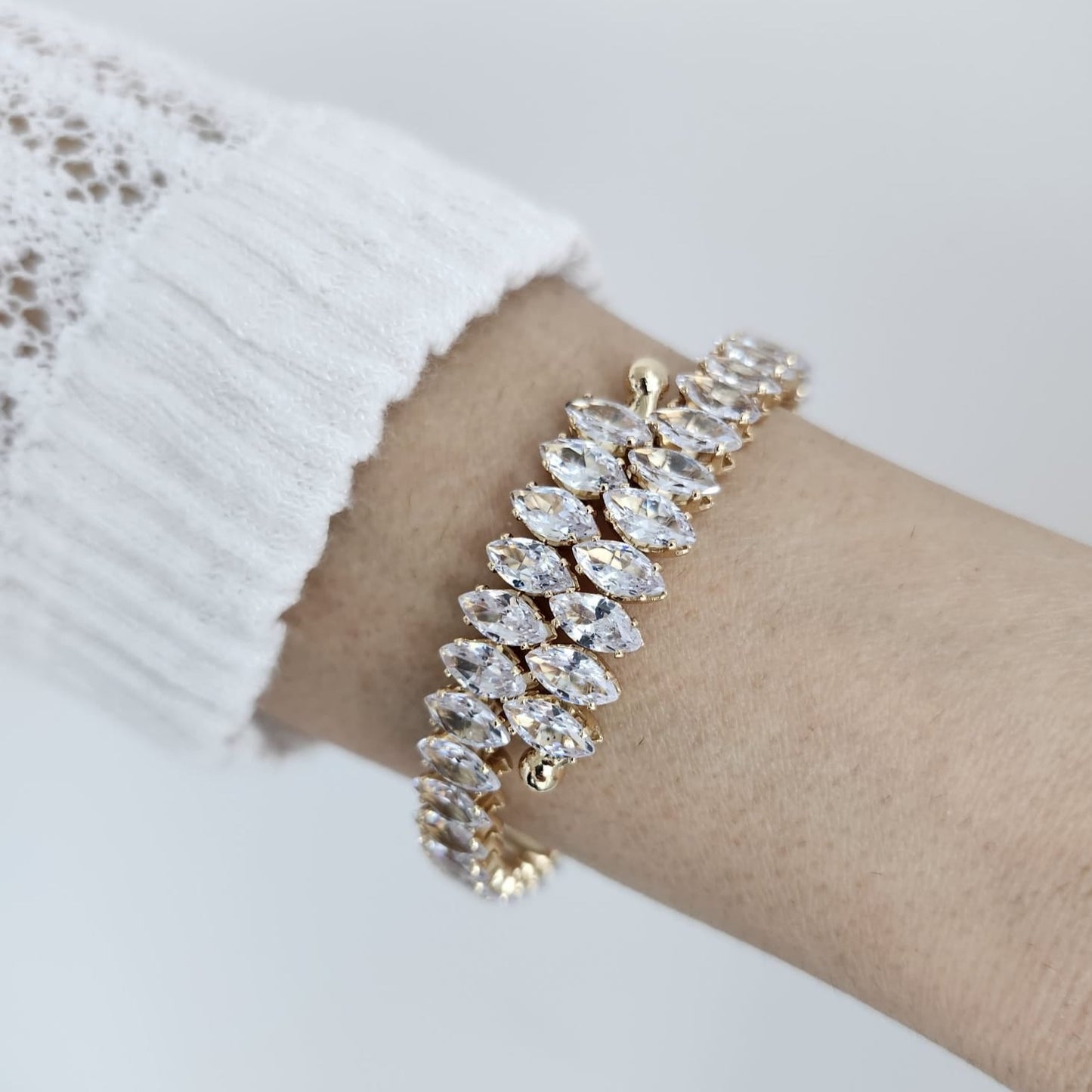 Illuminate with Elegance Stand Out with the Crystal-Studded Gold Bracelet